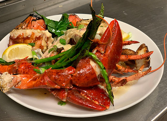 Lobster and asparagus at The Grill at Fairview Inn Restaurant, Marshfield, Massachusetts.