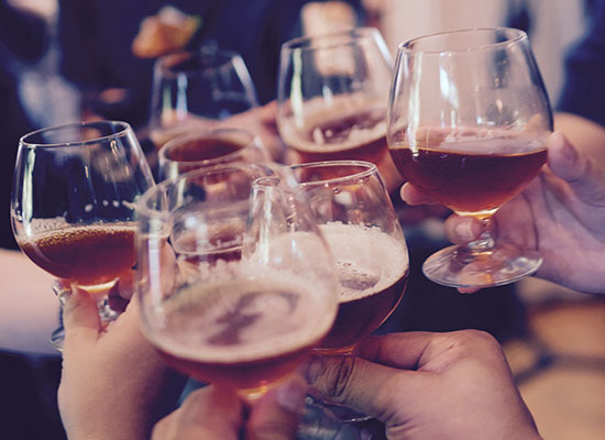 People toasting at The Grill at Fairview Inn Restaurant in Marshfield, Massachusetts.